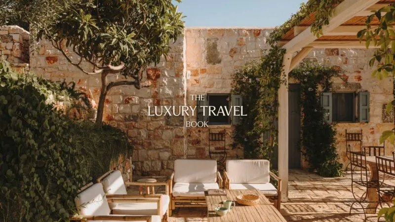 Courtyard in Italy with Luxury Travel Book logo as a feature image