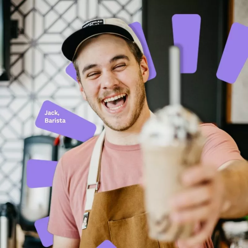 Image of male barista laughing holding coffee with branded sunshine ray behind in purple